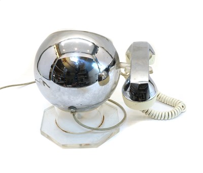 Lot 204 - An MCM chrome and lucite rotary telephone