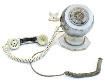 Lot 204 - An MCM chrome and lucite rotary telephone