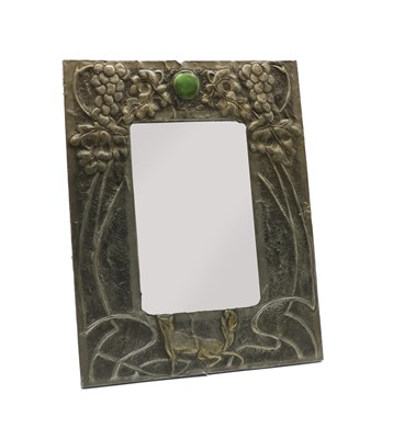 Lot 135 - An Arts & Crafts pewter table mirror