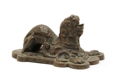 Lot 116 - A Chinese or Eastern bronze qilin weight
