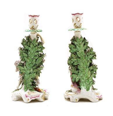 Lot 281 - A pair of Derby candlestick porcelain figures