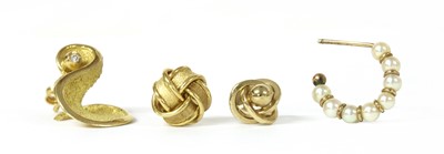 Lot 1404 - Four single gold earrings