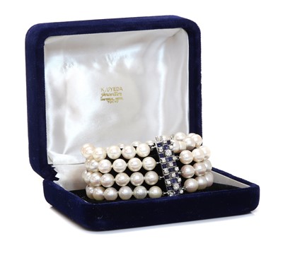 Lot 312 - A four row cultured pearl bracelet