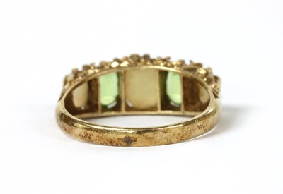 Lot 1262 - A 9ct gold opal and peridot ring