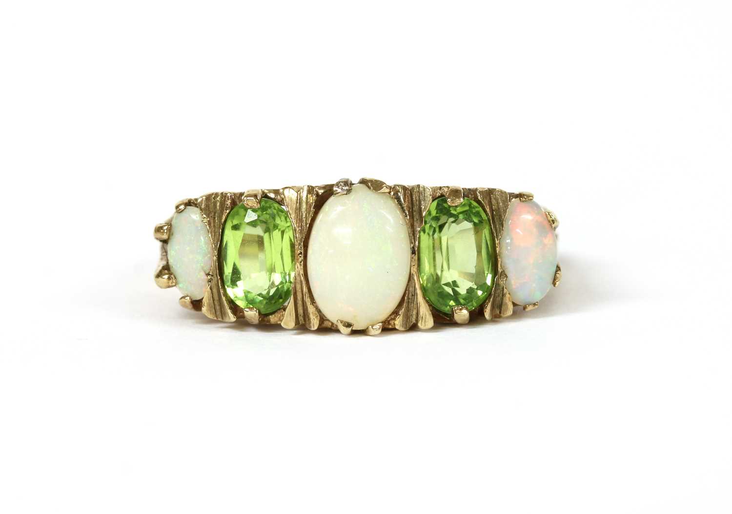 Lot 1262 - A 9ct gold opal and peridot ring