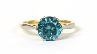 Lot 1294 - A gold single stone blue zircon ring