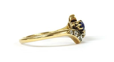 Lot 1026 - An Edwardian gold sapphire and diamond crossover ring