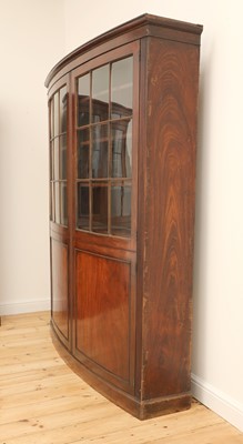 Lot 19 - A pair of mahogany bow front bookcases
