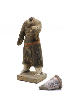 Lot 110 - A Chinese terracotta male figure