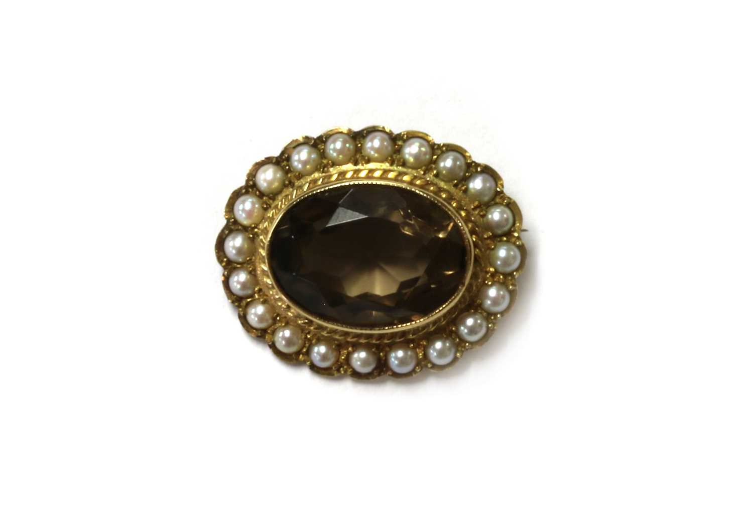 Lot 142 - A 9ct gold smoky quartz and split pearl brooch