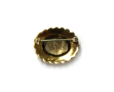 Lot 142 - A 9ct gold smoky quartz and split pearl brooch