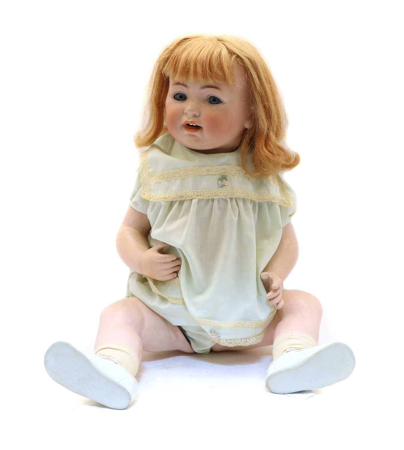 Lot 245 - A bisque head doll