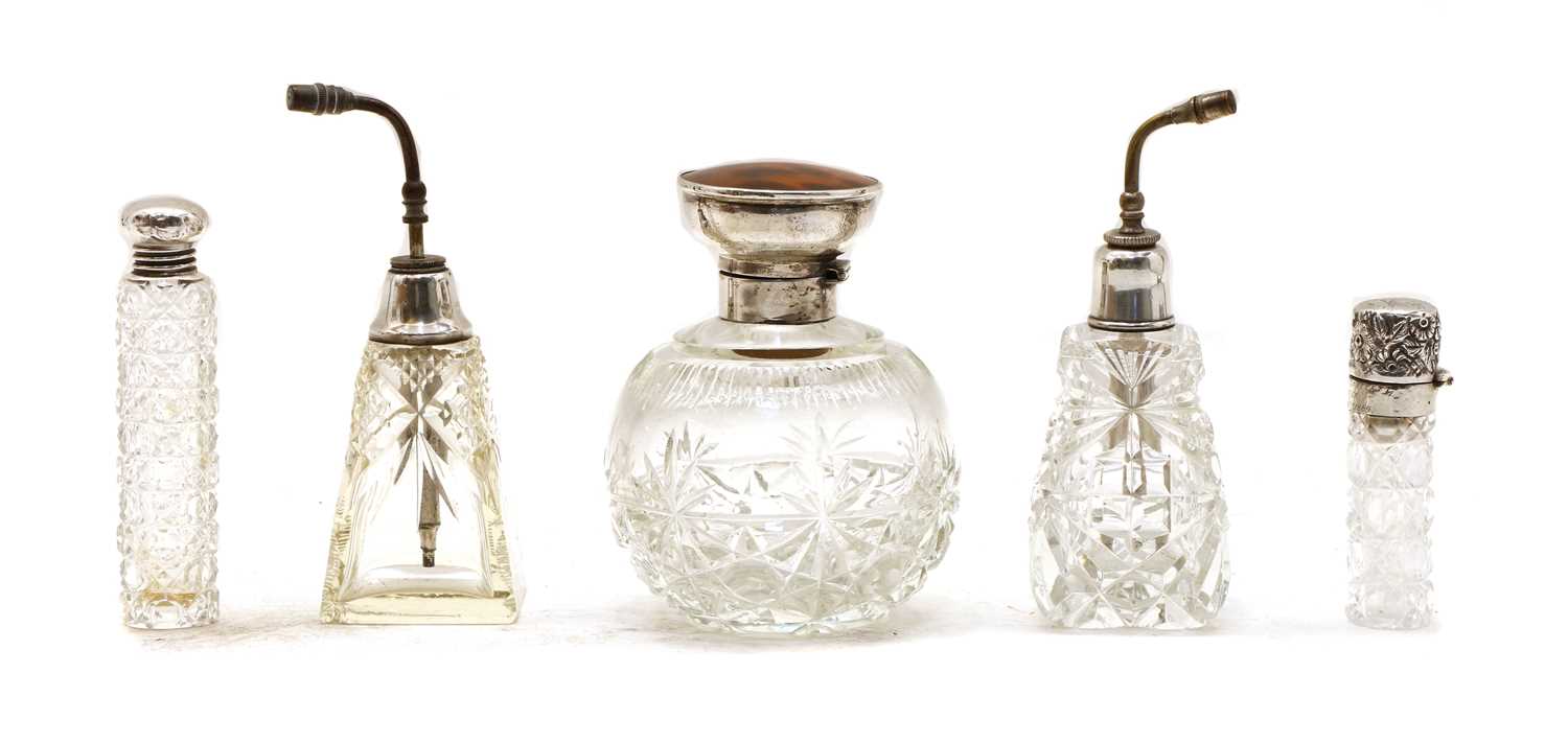 Lot 16 - Five cut glass silver collared perfume bottles