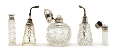 Lot 16 - Five cut glass silver collared perfume bottles