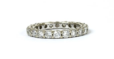 Lot 1202 - A white gold diamond full eternity ring