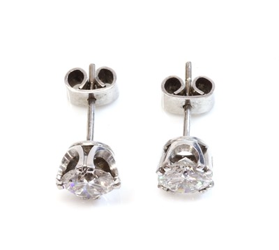 Lot 353 - A pair of white gold single stone diamond stud earrings