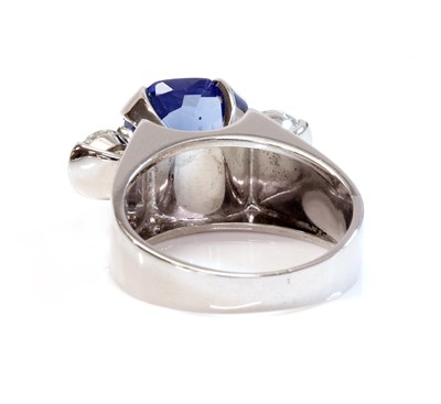 Lot 454 - A platinum sapphire and diamond three stone ring