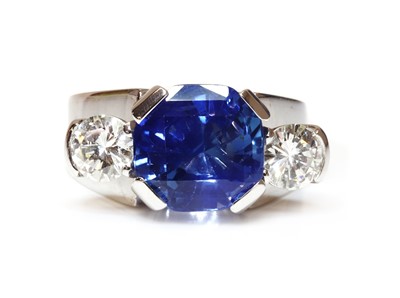 Lot 454 - A platinum sapphire and diamond three stone ring