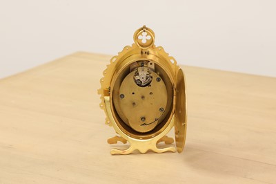 Lot 228 - An oval brass strut clock