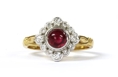 Lot 221 - An 18ct gold ruby and diamond off set square cluster ring
