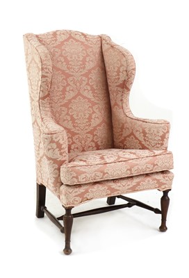 Lot 630 - A 19th century wing back armchair
