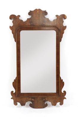 Lot 415 - A George III style yew wood fret carved mirror