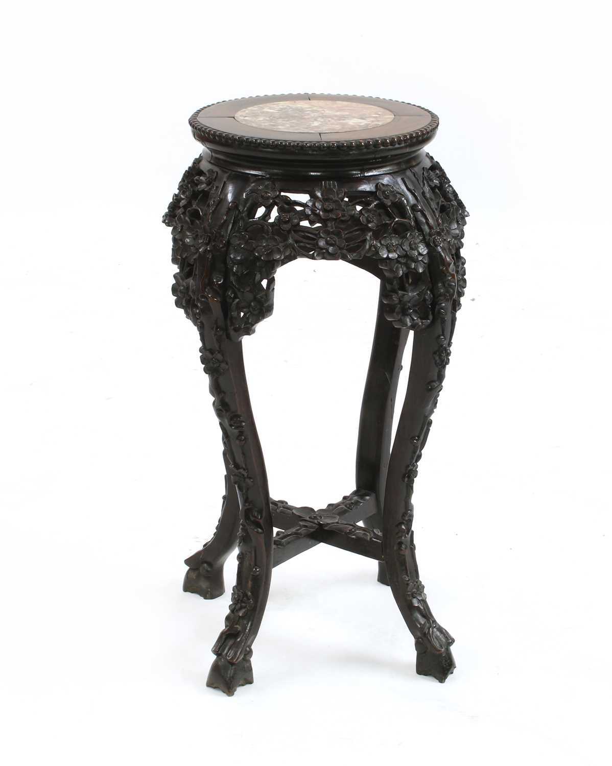 Lot 84 - A Chinese hardwood jardiniere stand