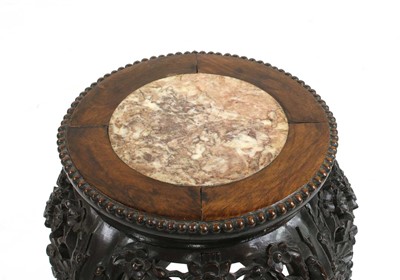 Lot 84 - A Chinese hardwood jardiniere stand