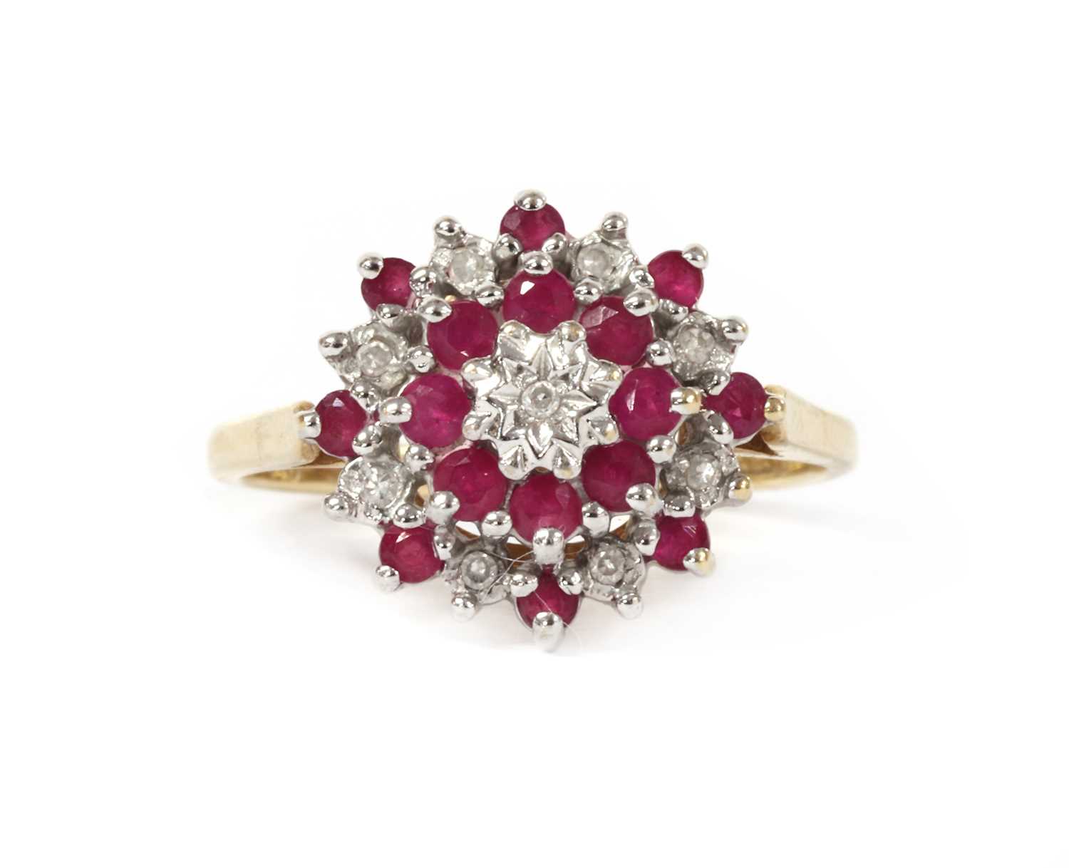 Lot 1221 - A 9ct gold diamond and ruby target cluster
