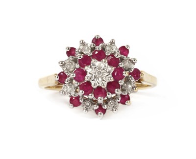 Lot 1221 - A 9ct gold diamond and ruby target cluster ring