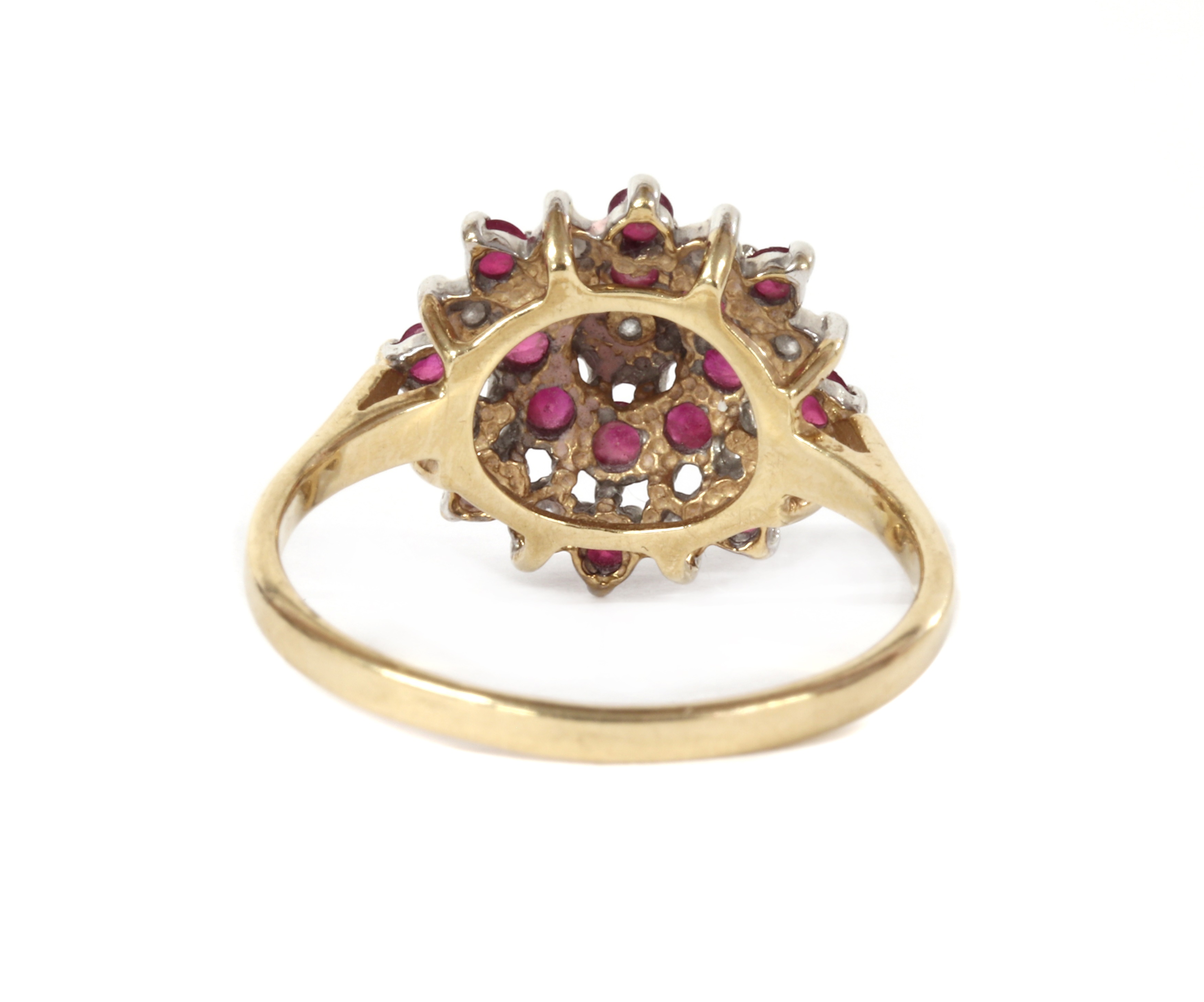 Lot 1221 - A 9ct gold diamond and ruby target cluster