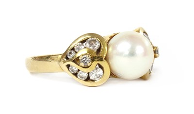 Lot 1310 - A gold cultured pearl and diamond ring