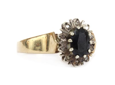 Lot 1286 - A 9ct gold sapphire and diamond cluster ring
