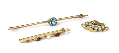 Lot 1352 - A gold ruby and seed pearl bar brooch