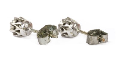 Lot 1210 - A pair of 9ct white gold single stone diamond stud earrings