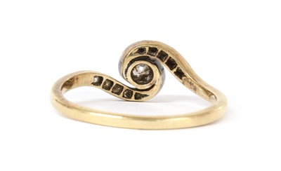 Lot 1170 - A gold diamond crossover ring