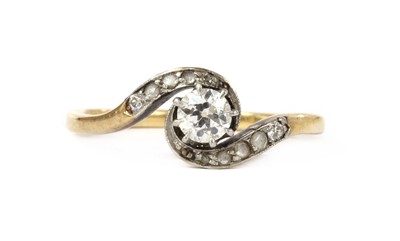 Lot 1170 - A gold diamond crossover ring