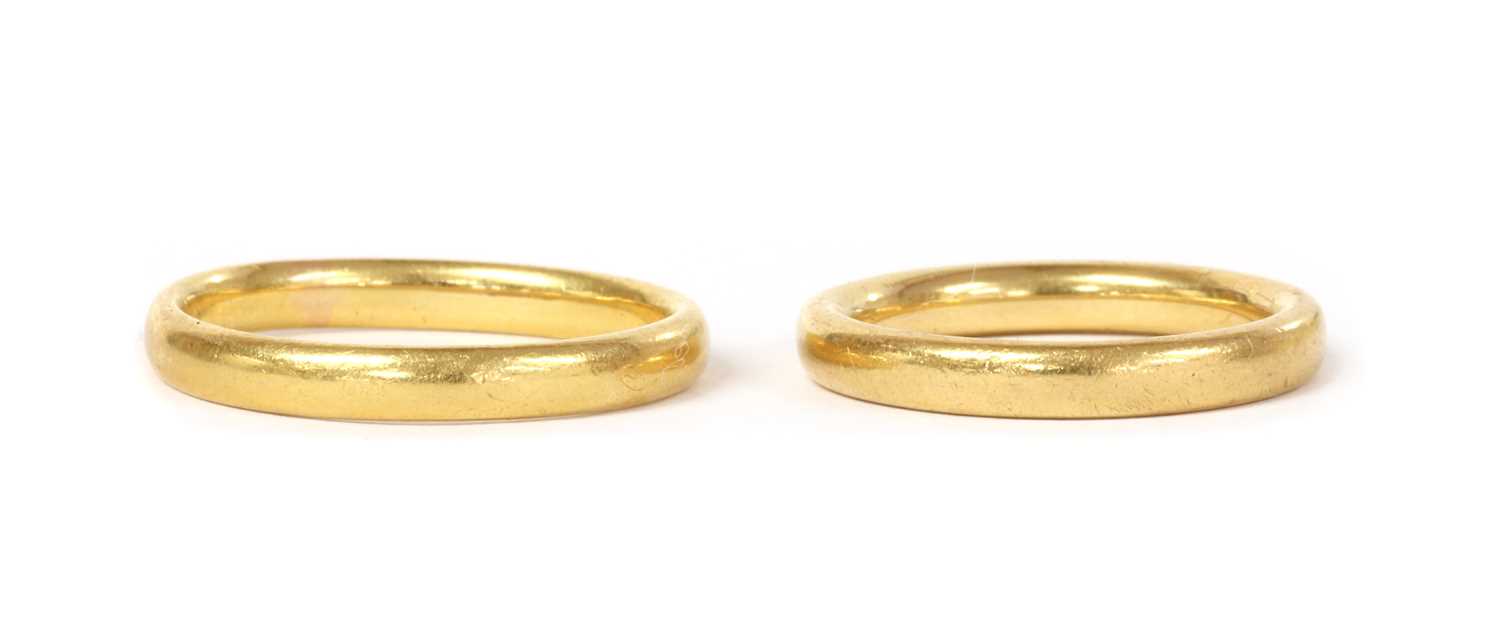 Lot 1073 - Two 22ct gold court section wedding rings