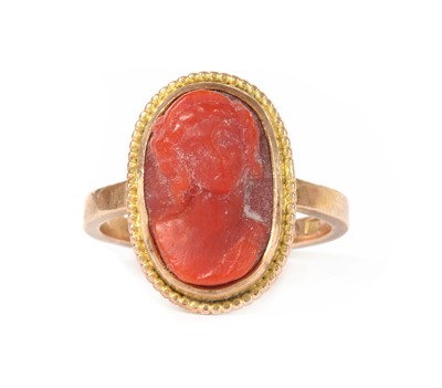 Lot 1238 - A gold coral cameo ring