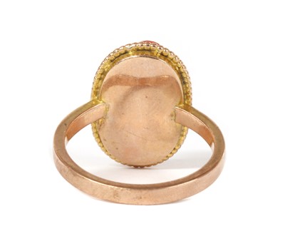 Lot 1238 - A gold coral cameo ring