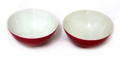 Lot 64 - A pair of Chinese ruby-enamelled tea bowls