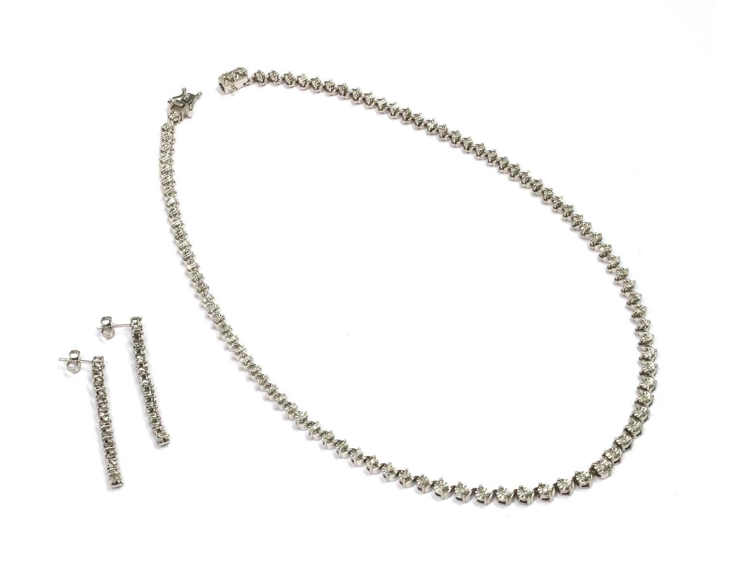Lot 81 - A silver diamond set necklace and earrings suite