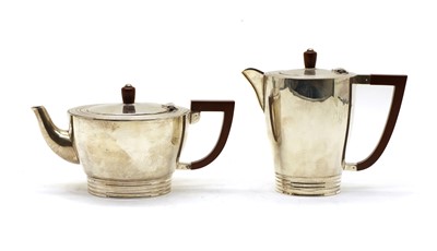 Lot 11 - A silver teapot and a hot water jug