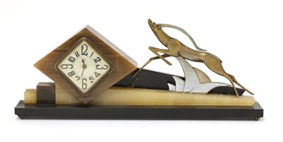 Lot 188 - An Art Deco marble and onyx mantel clock