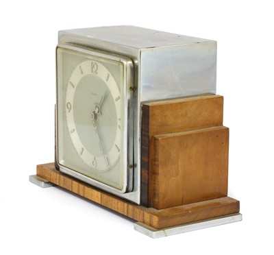 Lot 173 - An Art Deco walnut and rosewood mantel clock
