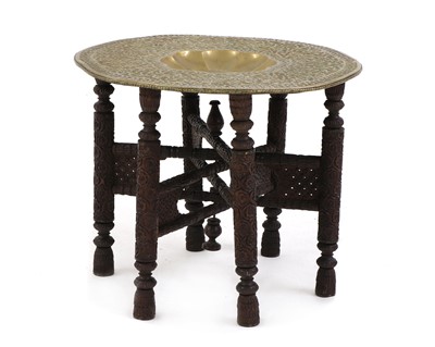 Lot 381 - A Moorish brass topped hardwood occasional table