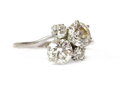 Lot 1199 - A white gold four stone diamond cluster ring