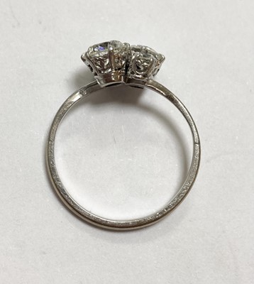 Lot 1199 - A white gold four stone diamond cluster ring