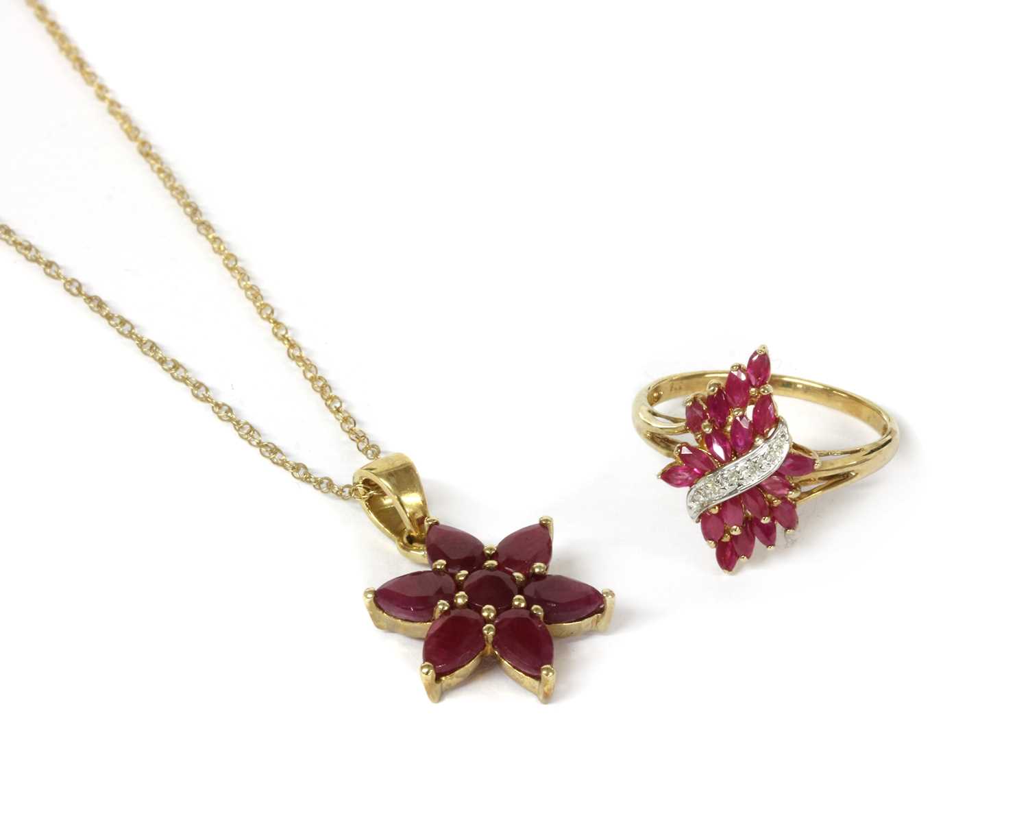 Lot 96 - A 9ct gold fracture filled ruby set star cluster pendant