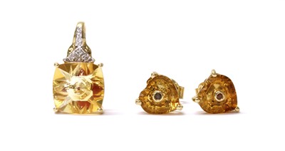 Lot 145 - A 9ct gold fantasy cut citrine and diamond pendant